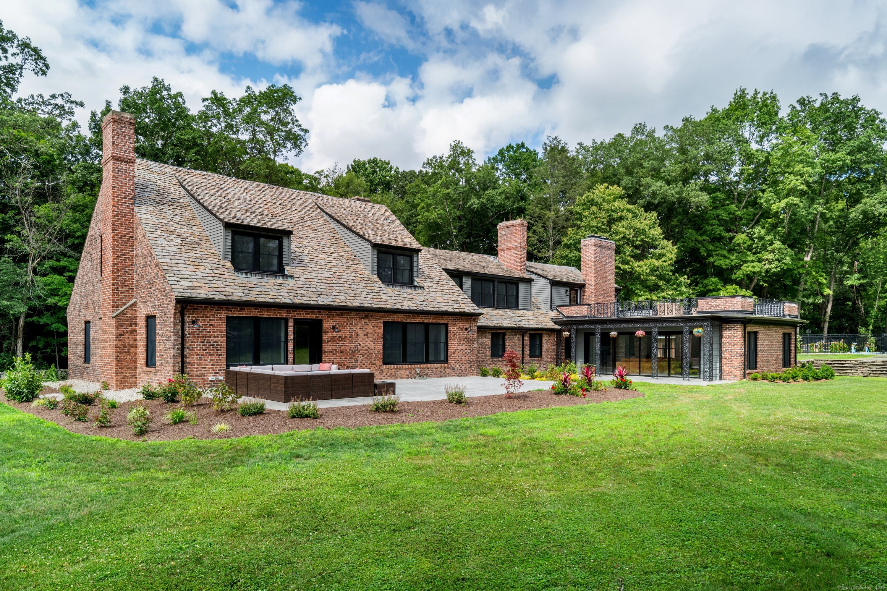 372 Tucker Hill Road Middlebury, CT 06762 - Photo 5 of 33 a front view of house with yard and outdoor seating