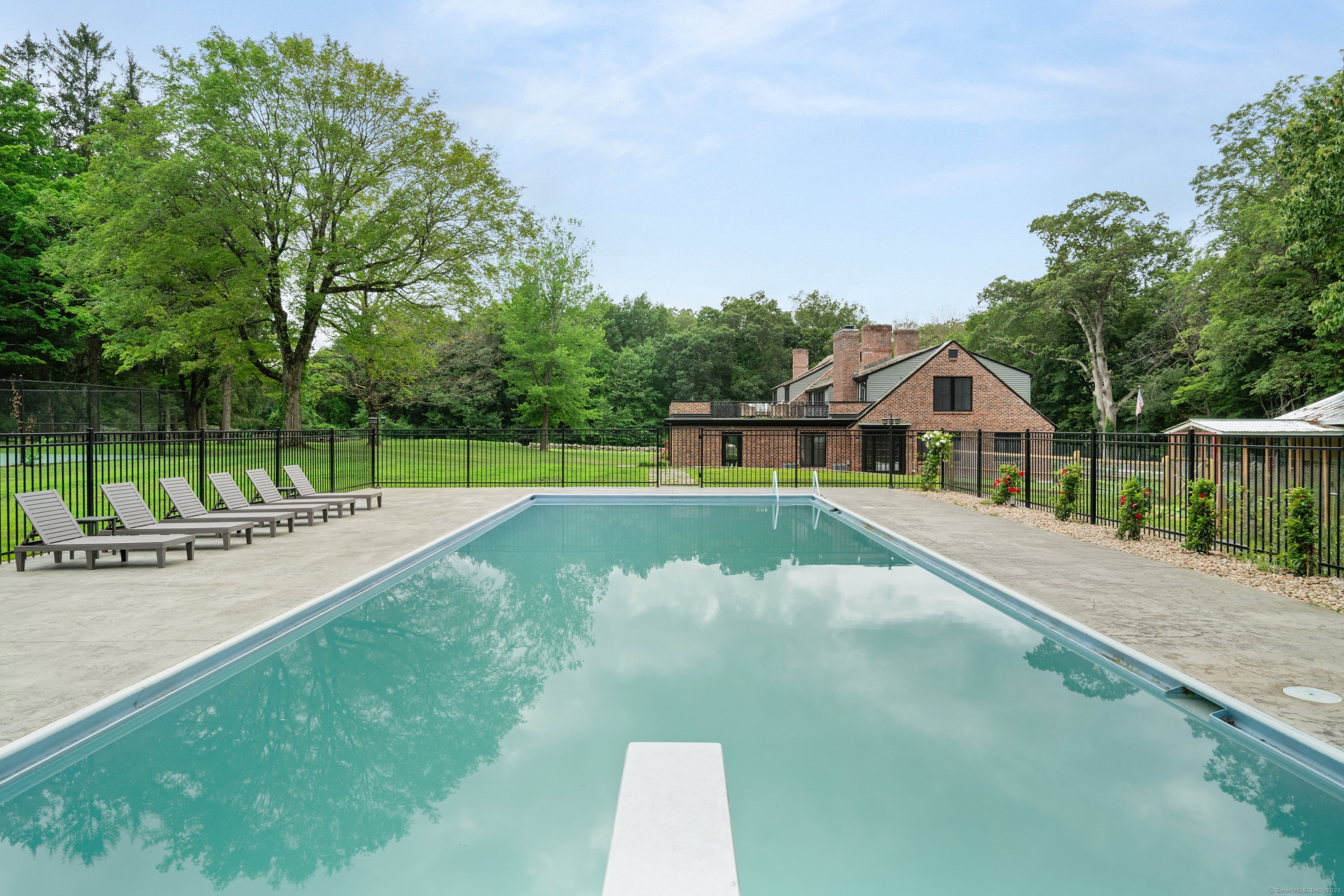 372 Tucker Hill Road Middlebury, CT 06762 - Photo 8 of 33 a view of a swimming pool with a yard