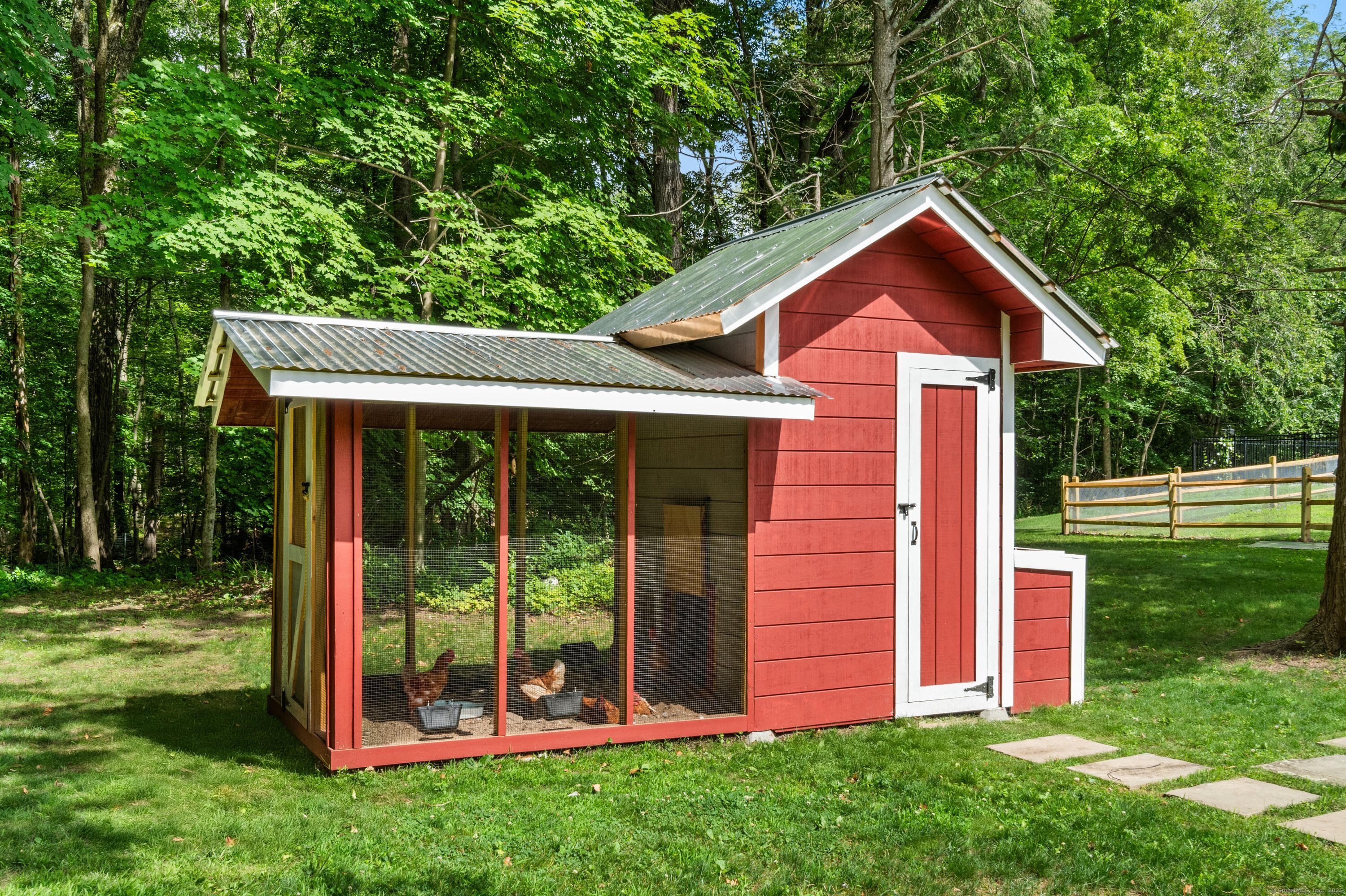 372 Tucker Hill Road Middlebury, CT 06762 - Photo 9 of 33 a front view of a house with a yard