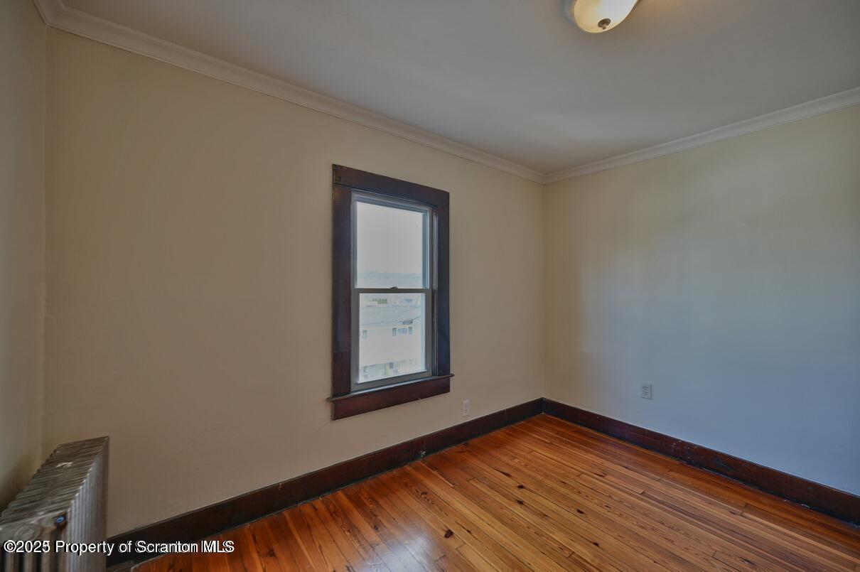 1025 Ridge Avenue Scranton, PA 18510 - Photo 22 of 49 a view of empty room with wooden floor and fan