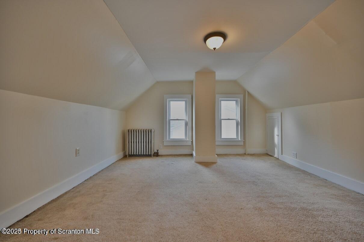 1025 Ridge Avenue Scranton, PA 18510 - Photo 41 of 49 a view of an empty room with window and wooden floor