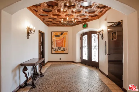 a view of a hallway with a chandelier