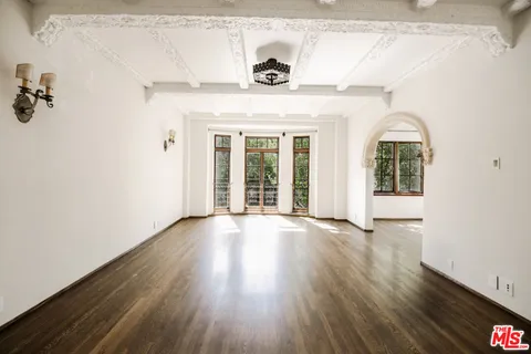 a view of an entryway with wooden floor