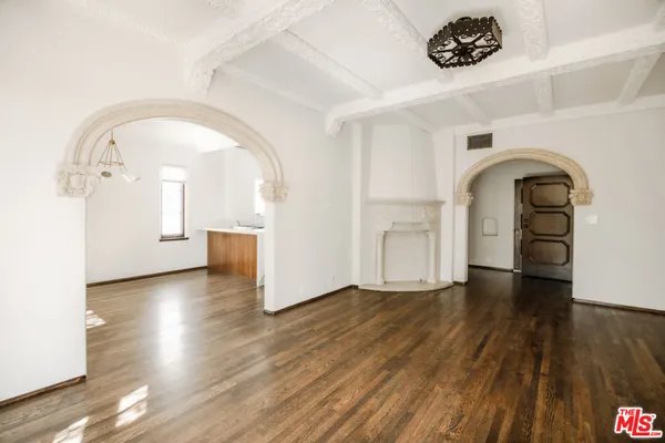 a view of a livingroom with wooden floor