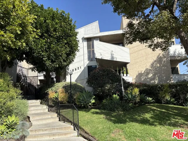 a sign board with yard in front of it