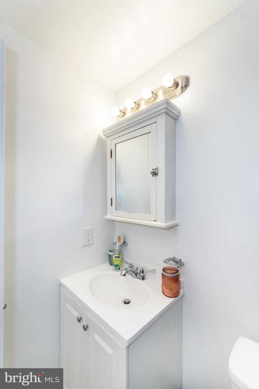 2514 13th Street Northwest Washington, DC 20009 - Photo 8 of 9 a bathroom with a sink and a mirror