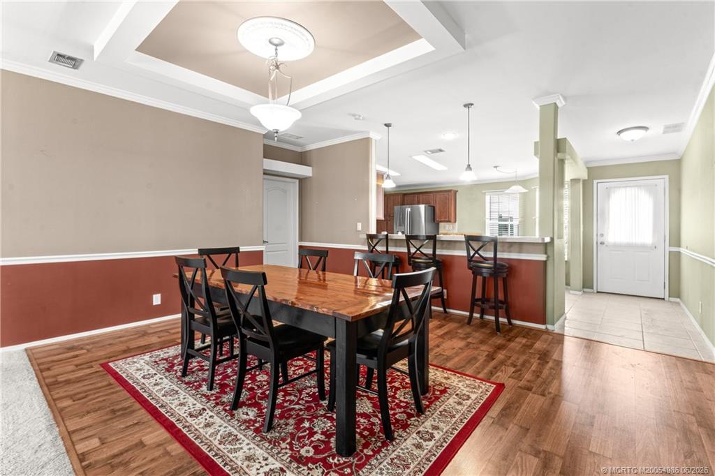 4237 4th Court Lantana, FL 33462 - Photo 16 of 40 a view of a a dining room with furniture window and wooden floor