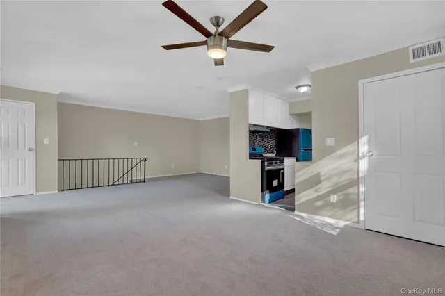 a view of a livingroom with a ceiling fan