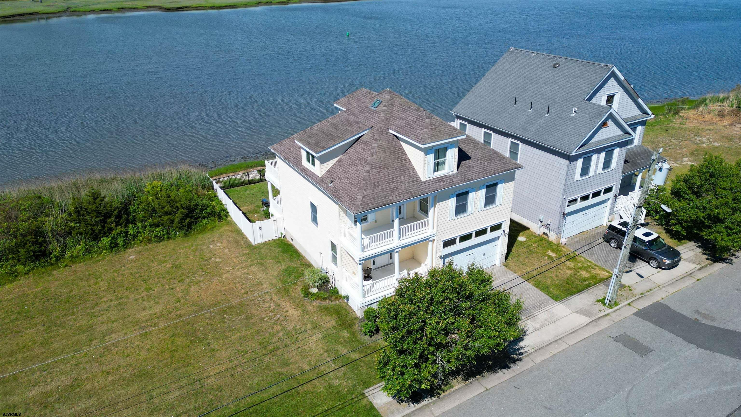 2070 West Riverside Drive Atlantic City, NJ 08401 - Photo 36 of 40 an aerial view of a house with a yard