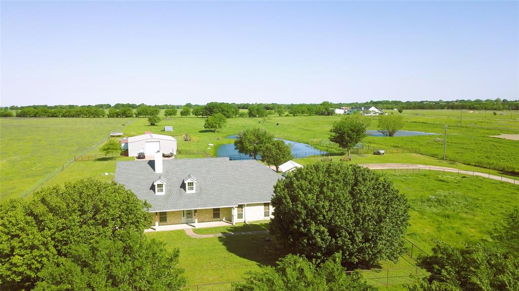 16445 County Road 221 Forney, TX 75126 - Photo 1 of 1 an aerial view of a house with a garden and lake view