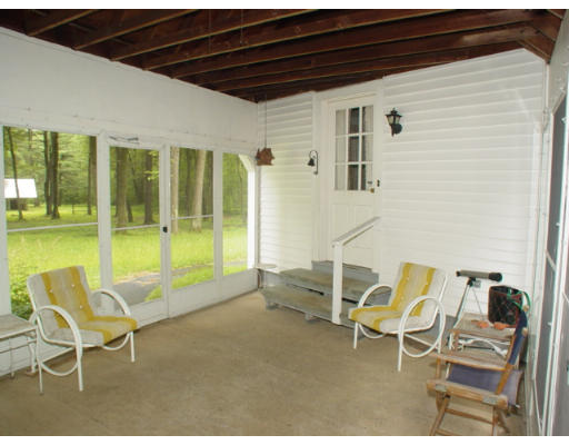 109 Pleasant Valley Road Amesbury, MA 01913 - Photo 7 of 8 a building outdoor space with patio furniture