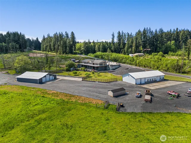 an aerial view of a house with outdoor space