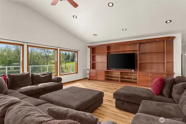 a living room with furniture window and a flat screen tv