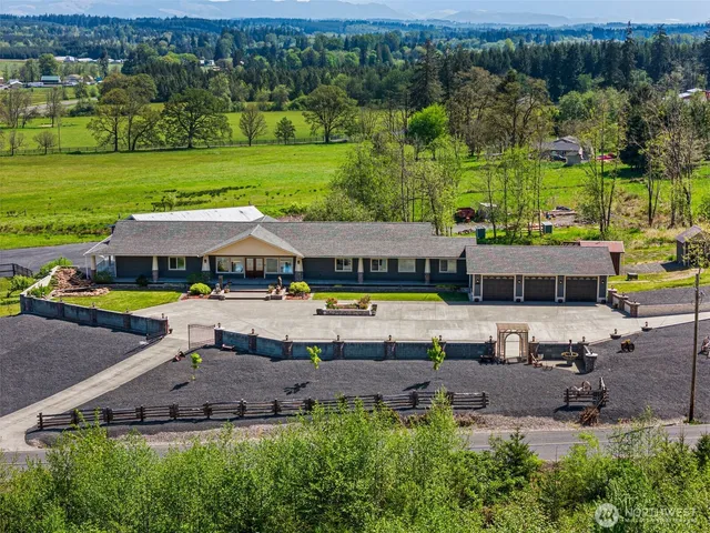 an aerial view of a house with a garden
