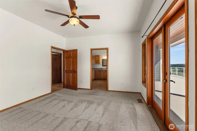 a kitchen with a stove and a wooden floor