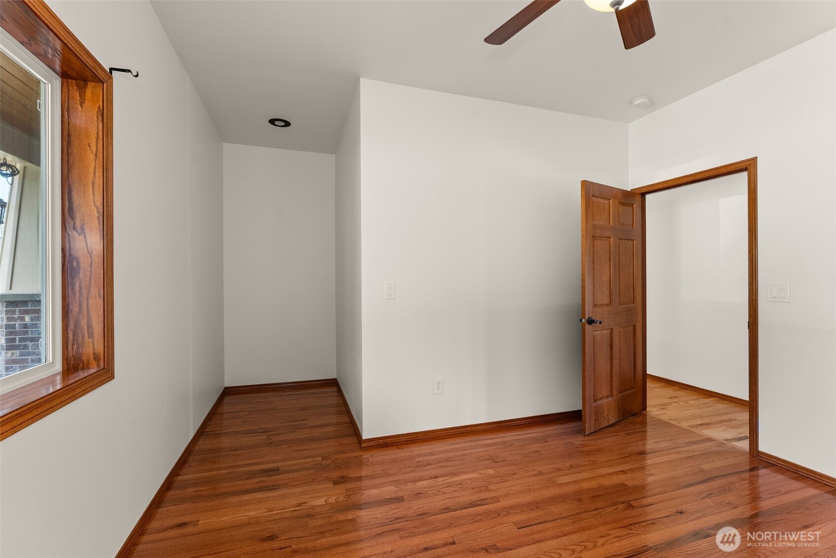 139 Coulson Road Chehalis, WA 98532 - Photo 25 of 40 a view of an empty room with wooden floor and a window