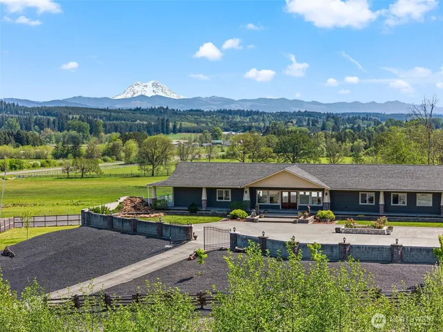 an aerial view of a swimming pool and mountain view