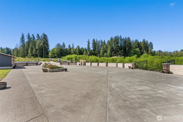 a front view of a house with a yard table and chairs