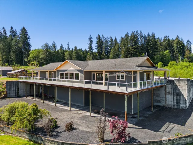 a view of a house with outdoor space and sitting area