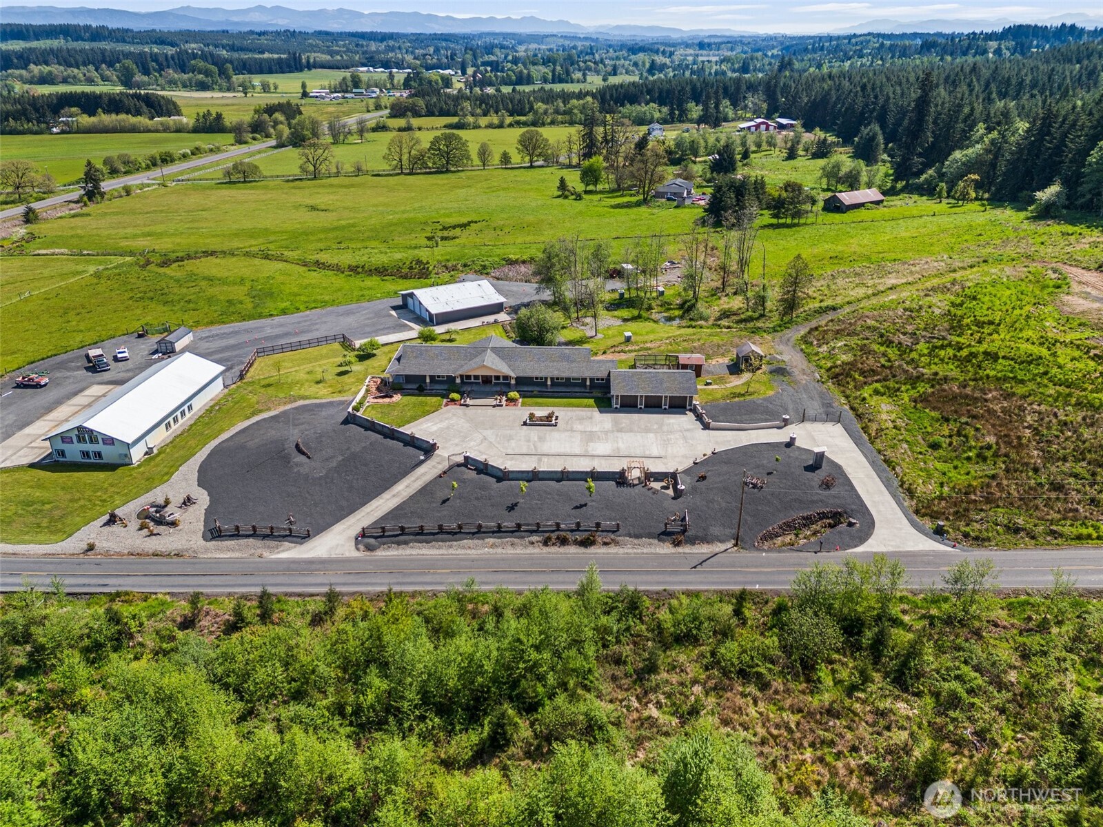 139 Coulson Road Chehalis, WA 98532 - Photo 37 of 40 an aerial view of a house with a garden and lake view