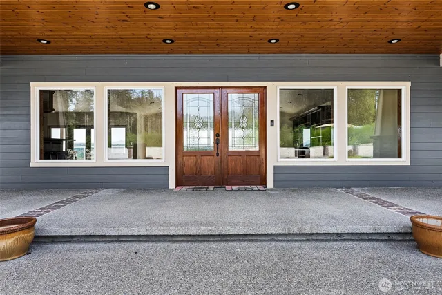 a view of front door of house with a chair