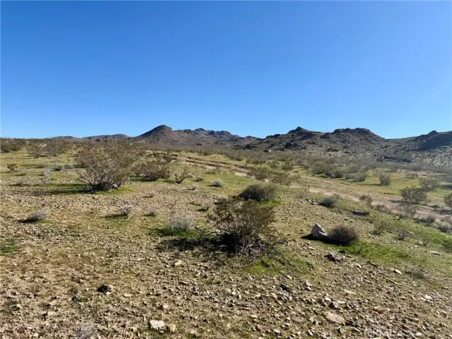 a view of mountain view with mountains in the background