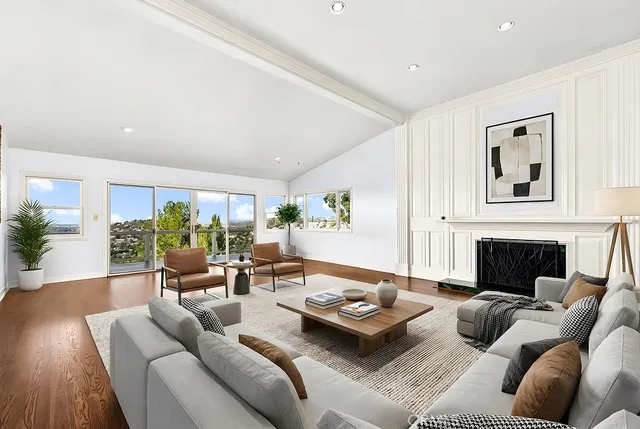 a living room with furniture couches and a fireplace