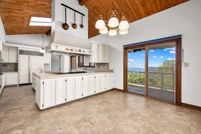 a kitchen with cabinets and window
