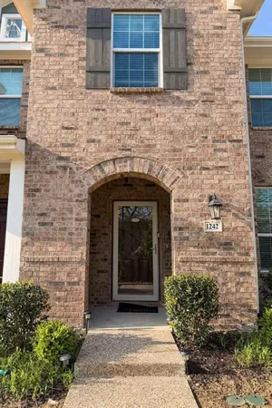 a front view of a house with an entrance