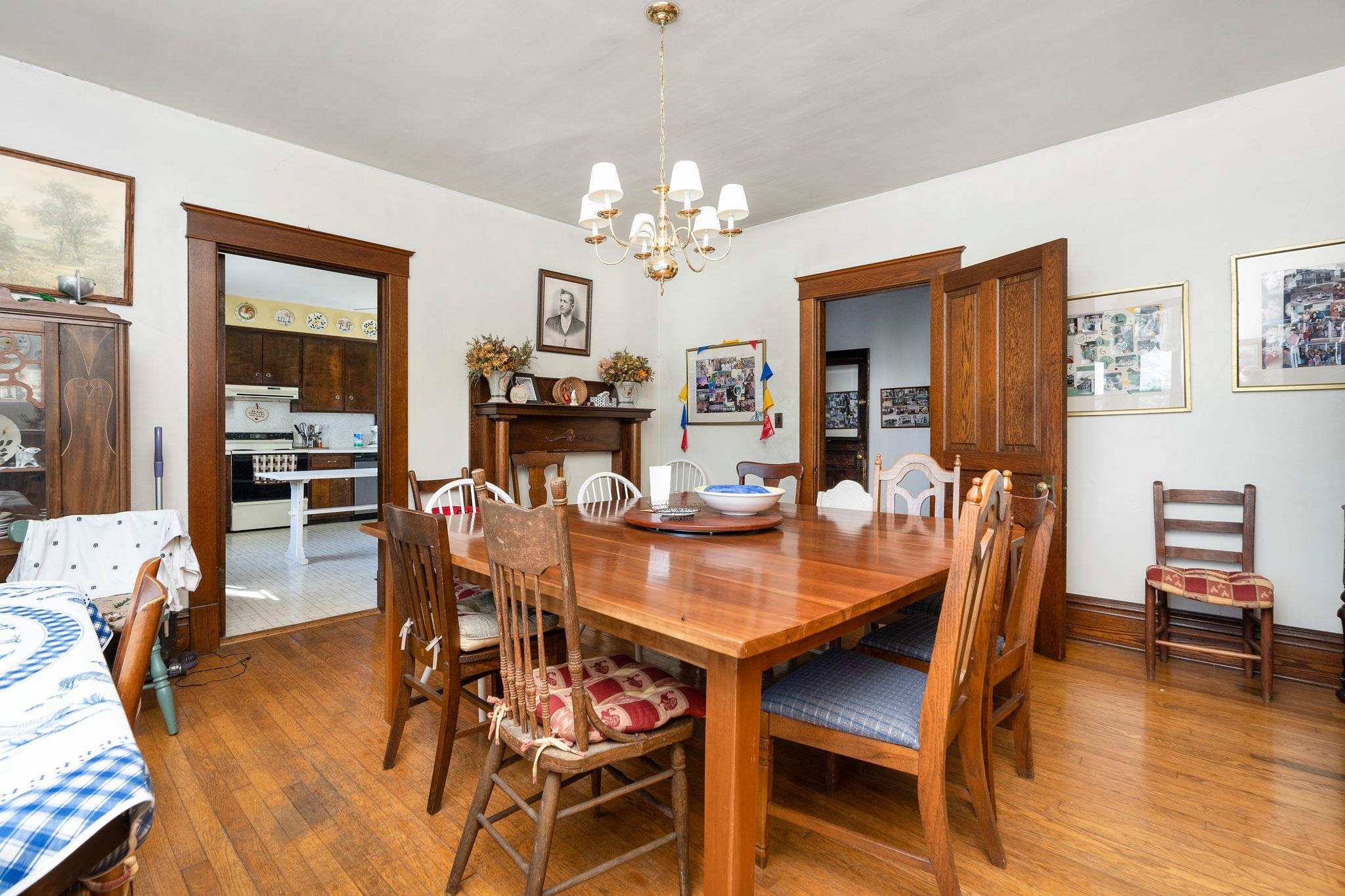 159 Buttermilk Road Mount Sidney, VA 24467 - Photo 13 of 75 a dining room with furniture a chandelier and wooden floor