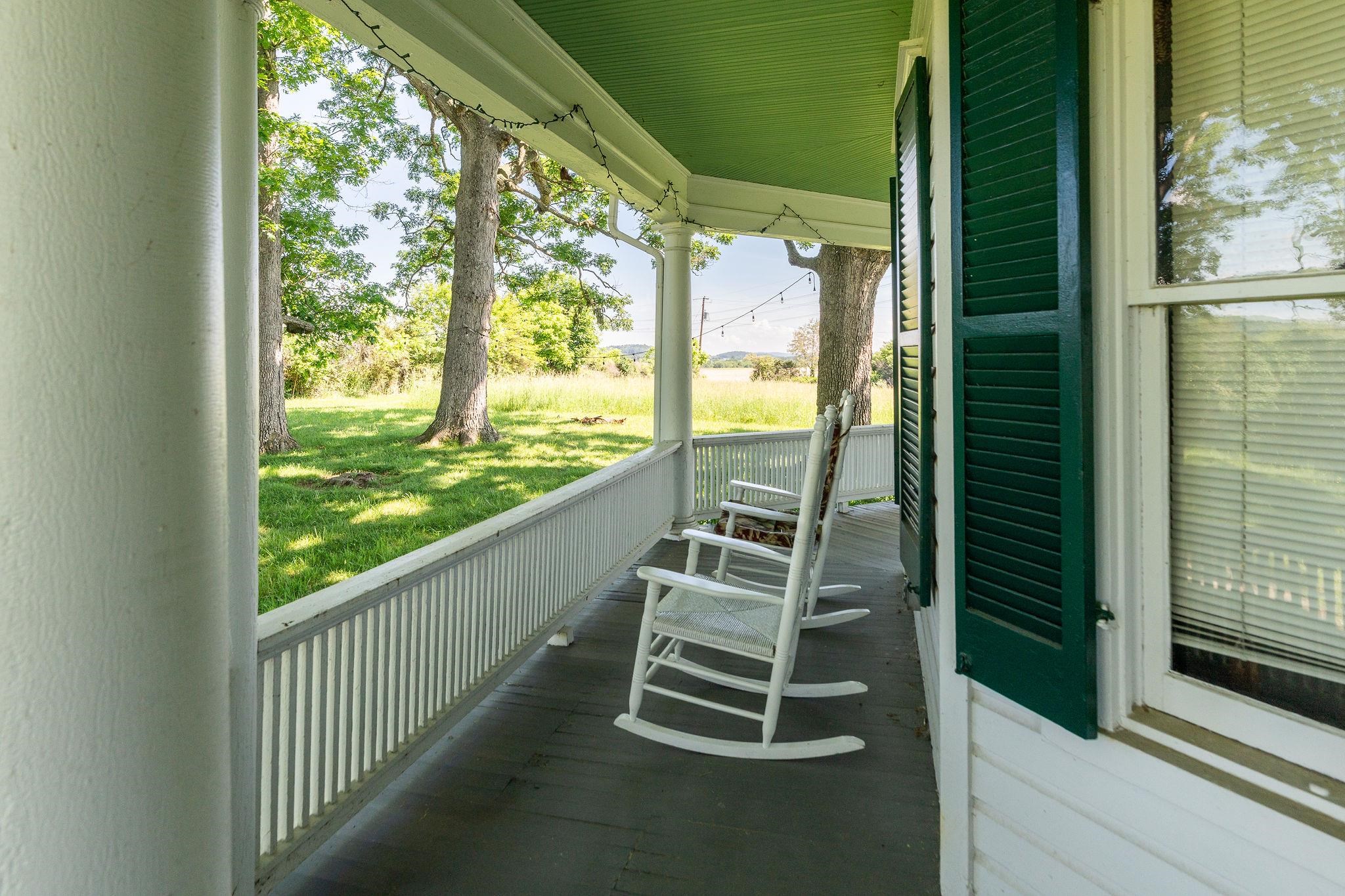 159 Buttermilk Road Mount Sidney, VA 24467 - Photo 6 of 75 a view of a balcony with couch and wooden floor