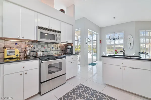 a kitchen with counter top space and cabinets