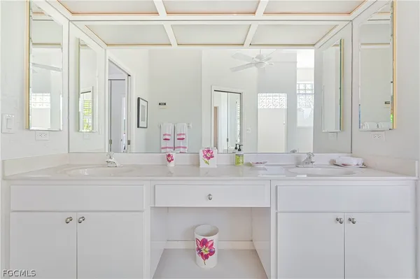 a white bath tub sitting next to a window