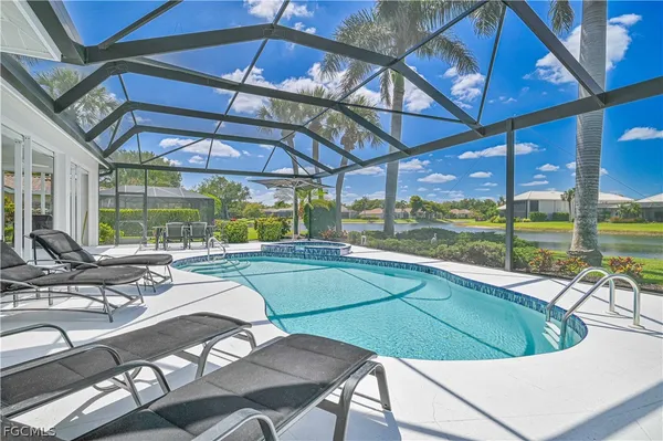 a view of a swimming pool with a patio