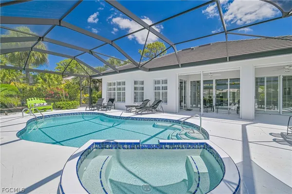 a view of a swimming pool with a patio
