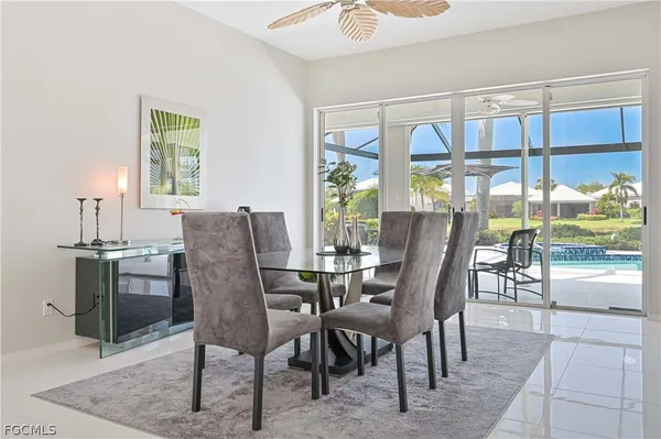 a view of a dining room with furniture window and outside view