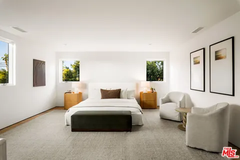 a bedroom with bed and window