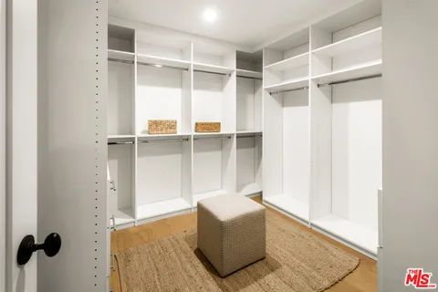 a view of an empty walk in closet