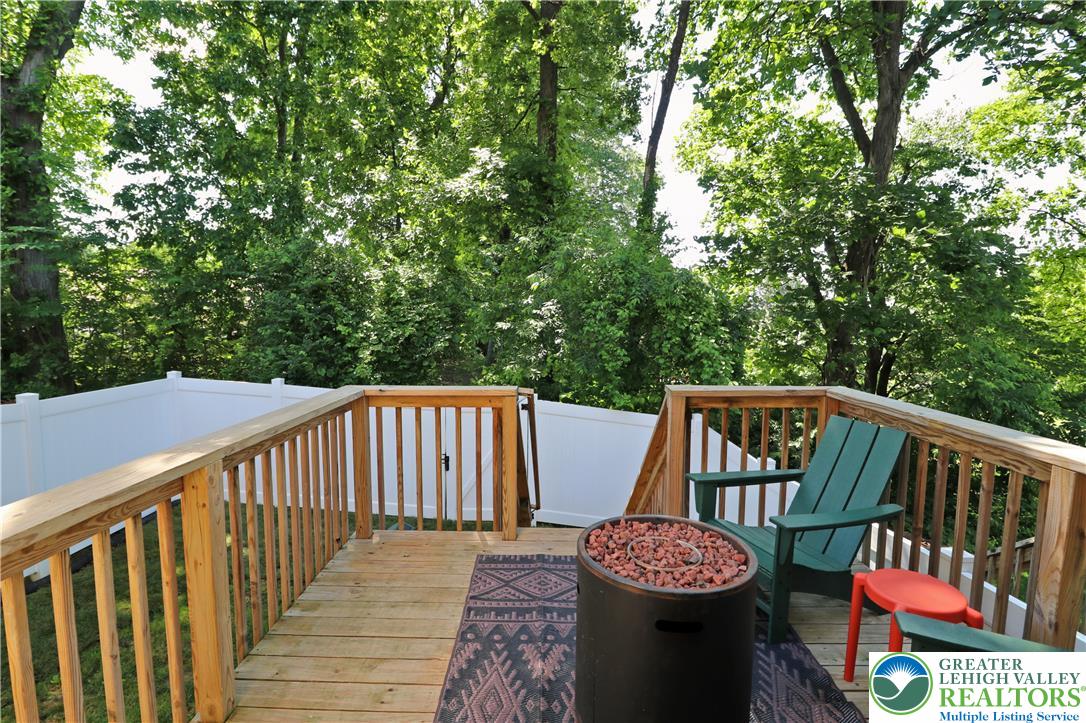 4502 Benjamin Court Emmaus, PA 18049 - Photo 17 of 53 Enjoy evening gatherings on the outdoor deck surrounded by natural greenery and privacy fencing.