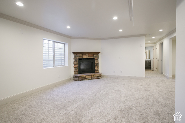 1742 Renaissance Way Springville, UT 84663 - Photo 15 of 23 Recessed lighting illuminating plush carpeting and a stone-faced fireplace with a wood mantle