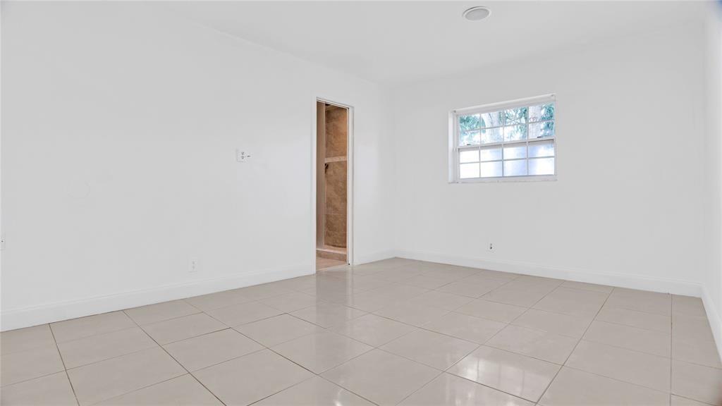 8241 Southwest 3rd Court North Lauderdale, FL 33068 - Photo 12 of 30 an empty room with windows