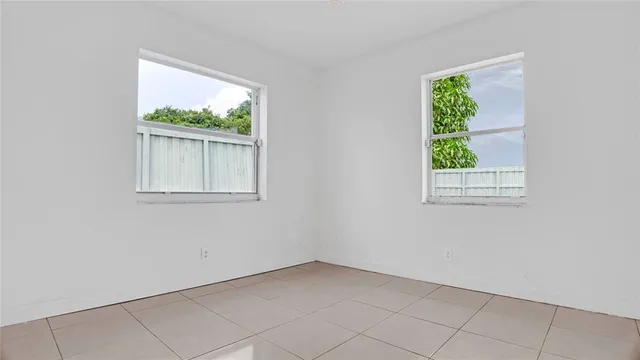 an empty room with shelves