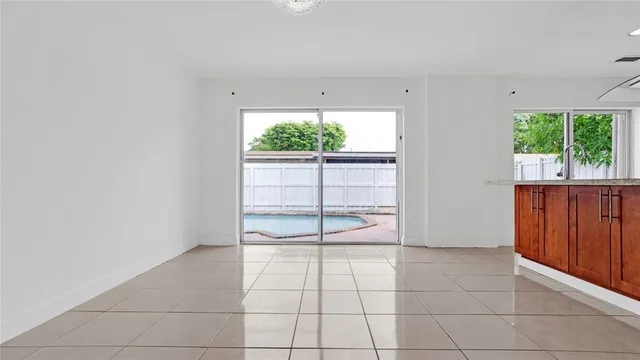 an empty room with cabinet and air conditioner