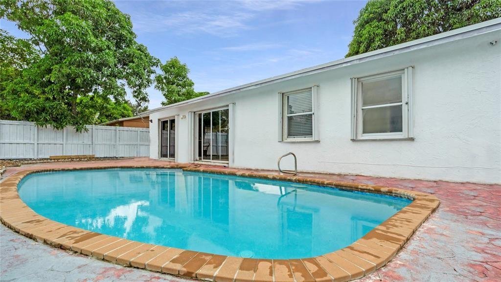 8241 Southwest 3rd Court North Lauderdale, FL 33068 - Photo 24 of 30 a view of a swimming pool with a yard