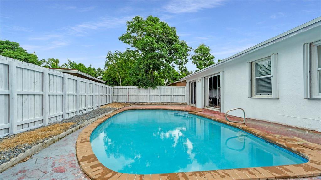8241 Southwest 3rd Court North Lauderdale, FL 33068 - Photo 25 of 30 a view of swimming pool with a backyard