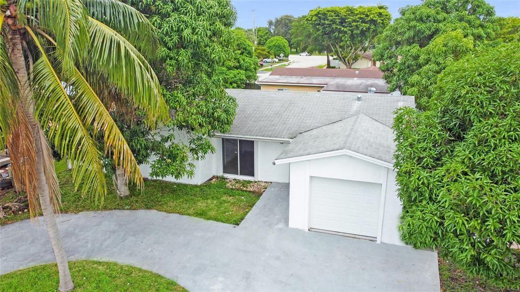 8241 Southwest 3rd Court North Lauderdale, FL 33068 - Photo 26 of 30 a aerial view of a house with a yard and potted plants