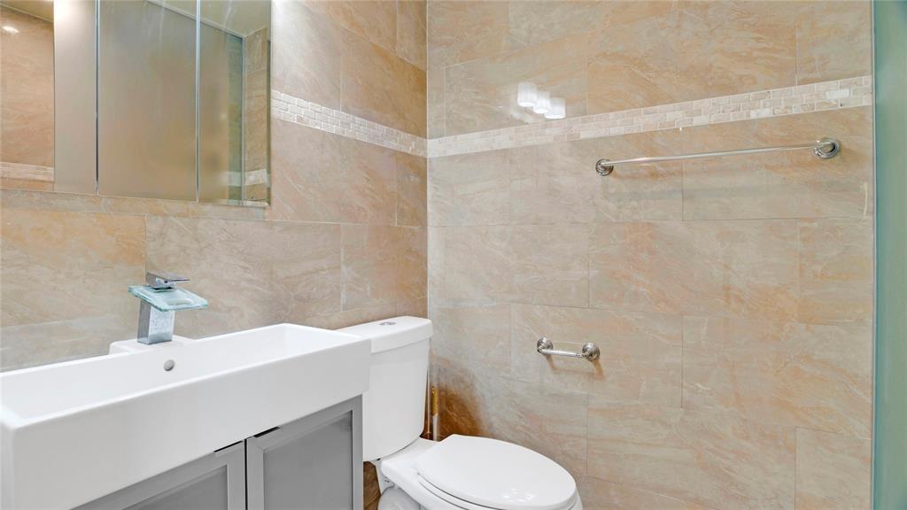 8241 Southwest 3rd Court North Lauderdale, FL 33068 - Photo 10 of 30 a bathroom with a sink a toilet and shower