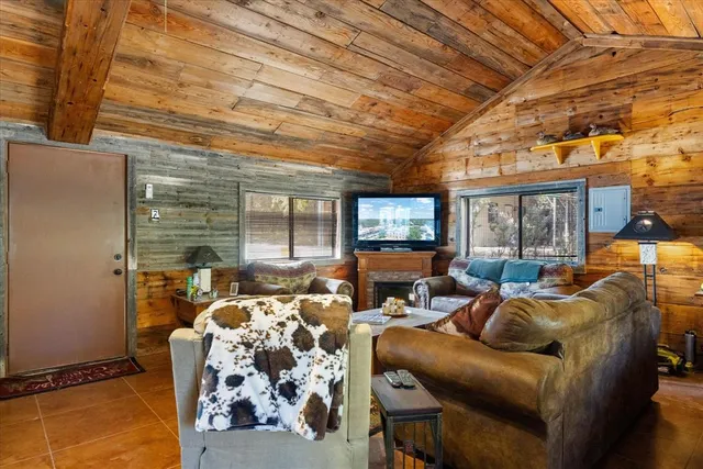 a living room with furniture a couch and a flat screen tv