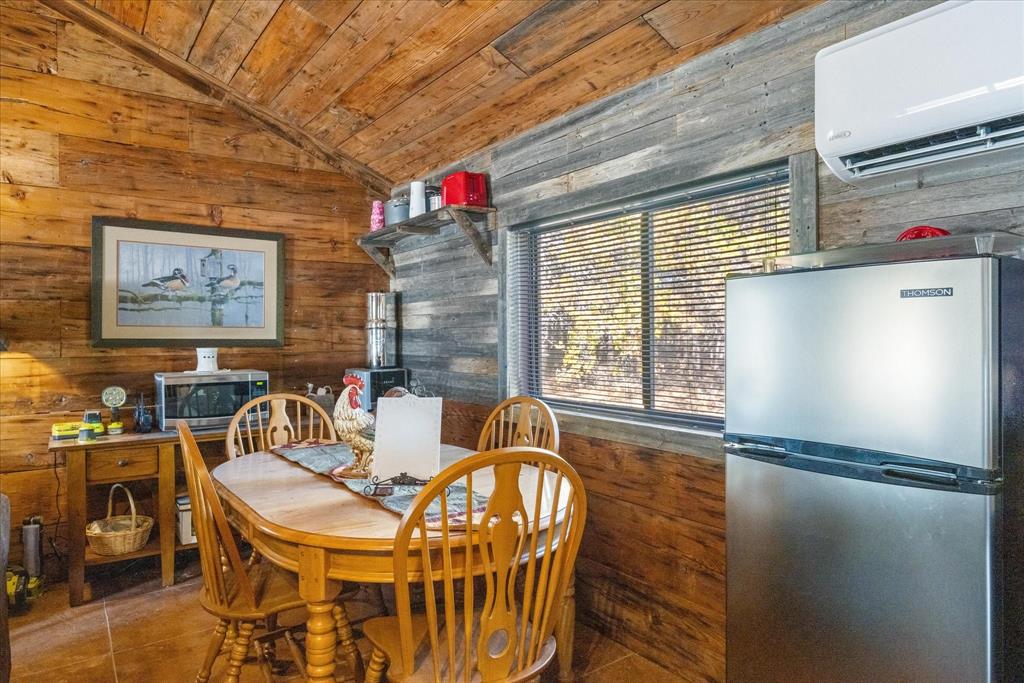 2500 Leech Road Poolville, TX 76487 - Photo 15 of 40 a dinning table and chairs in a room