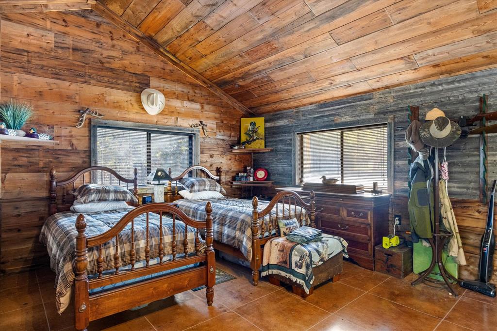 2500 Leech Road Poolville, TX 76487 - Photo 9 of 40 a living room with furniture a fireplace and a table